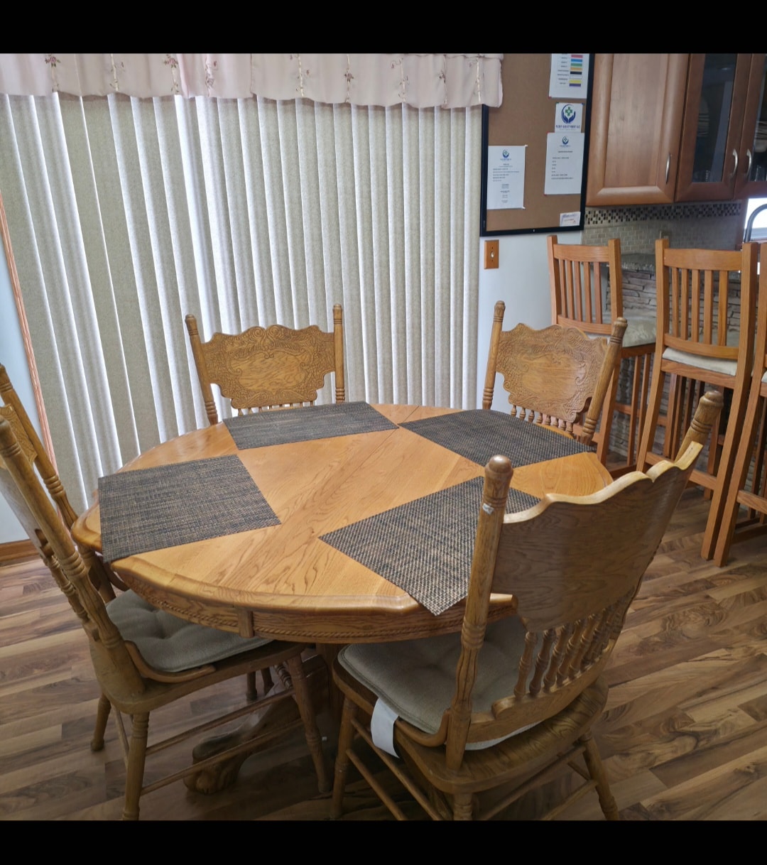 Wooden dining table with chairs at Floxy AbilityNest